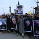 Protesters shout slogans against the United States and Israel as they hold posters with the image of top Iranian commander Qasem Soleimani, who was killed in a US airstrike in Iraq, and Iranian President Hassan Rouhani during a demonstration in the Kashmiri town of Magam on January 3, 2020.